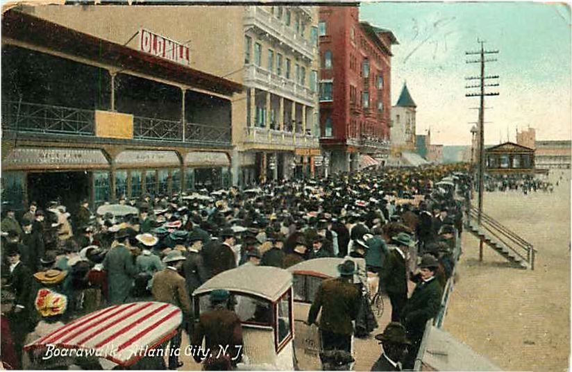 Atlantic City - The Old Mill and other attractions along a crowded boardwalk